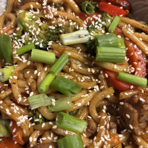 Close up of chicken and vegetable stir-fried noodles